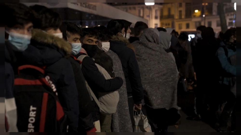 Migrants protesting in Paris call for safe housing while their applications are processed