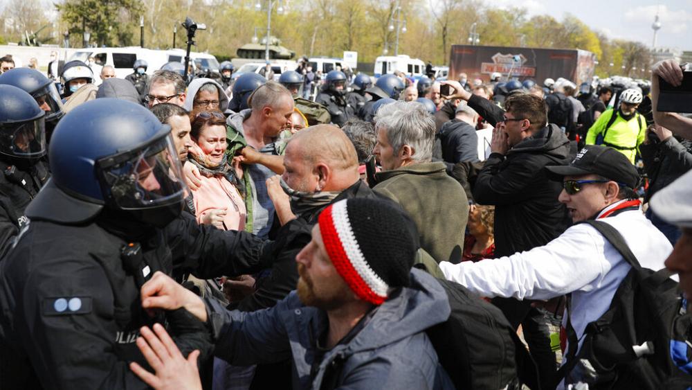 Protests in Berlin as parliament approves new COVID restrictions