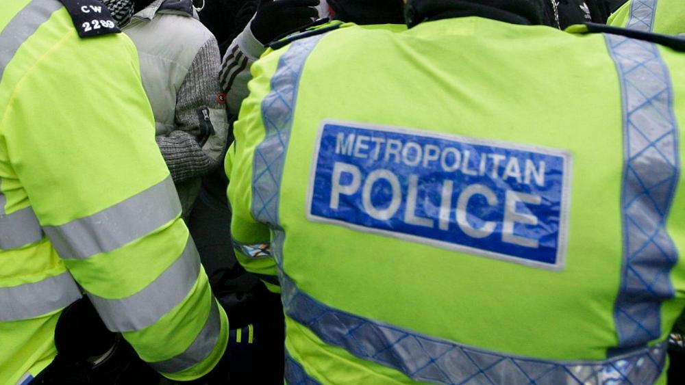 Two London police officers charged for taking selfies at murder scene