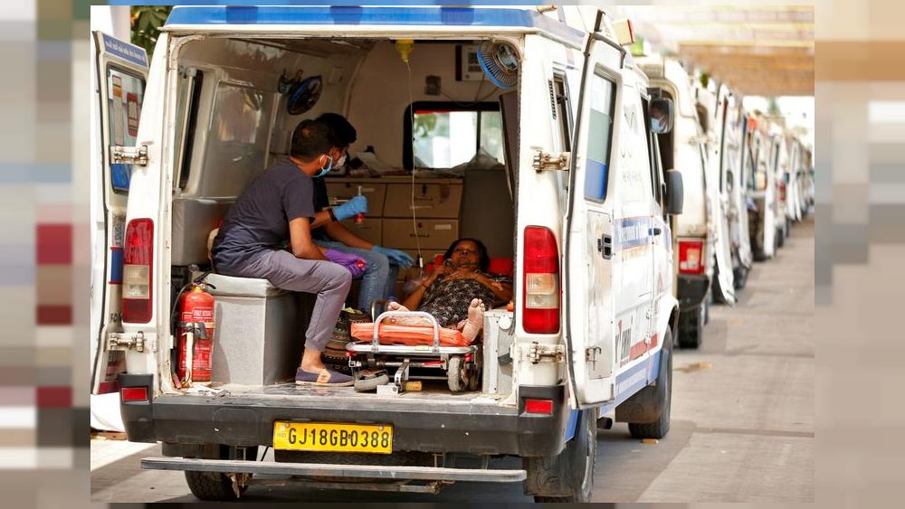 India infections top 18 million as gravediggers work round the clock