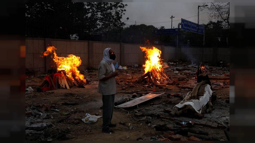 India's COVID-19 daily cases hold close to record, another state imposes lockdown