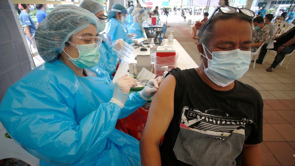 What is the argument against lifting COVID vaccine patents?