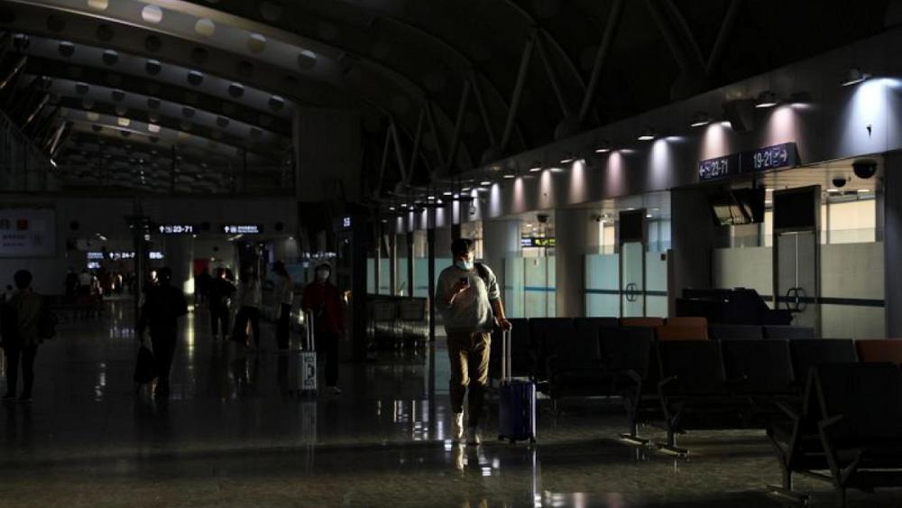 China reports 12 new COVID-19 cases vs seven a day earlier