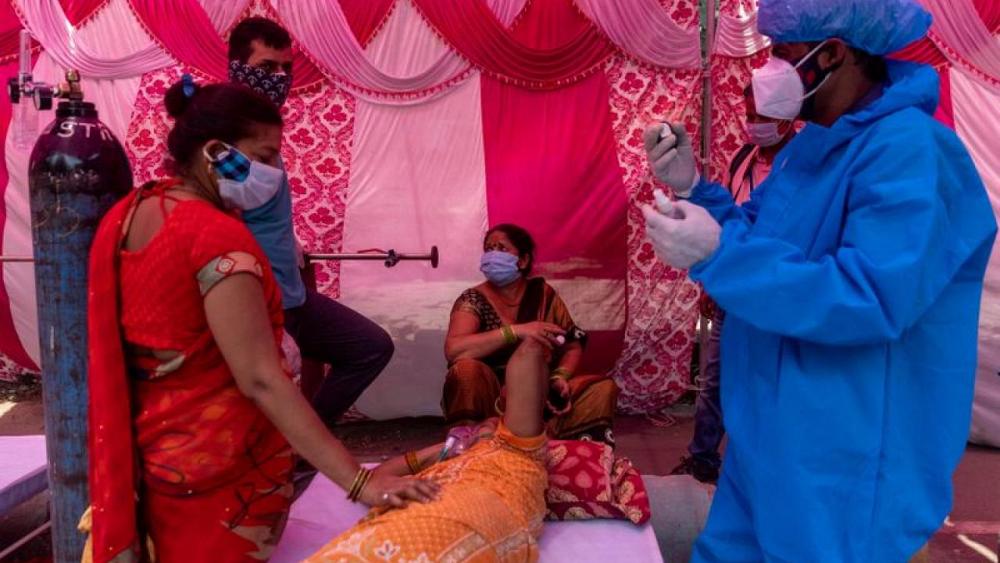 India's COVID-19 cases dip from peak, calls for shutdown mount