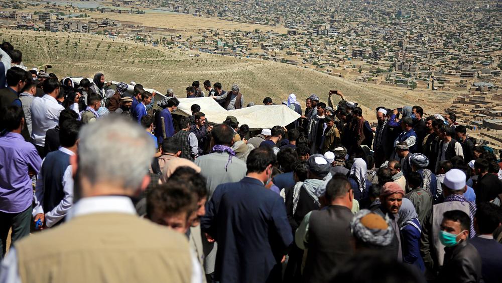 Afghans mourn schoolgirls killed in blasts as Taliban plans three-day ceasefire for Eid