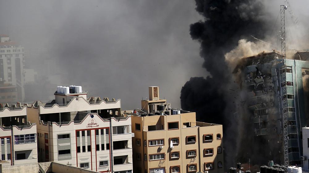 'Incredibly disturbing development': Israeli airstrike flattens media building in Gaza