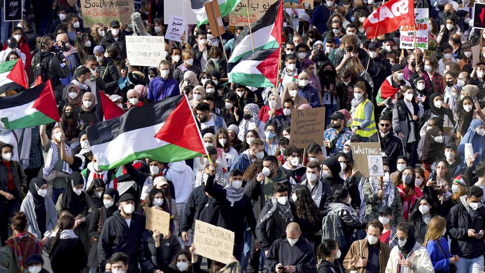 Clashes with police and Israeli TV reporter attacked at pro-Palestinian rally in Berlin