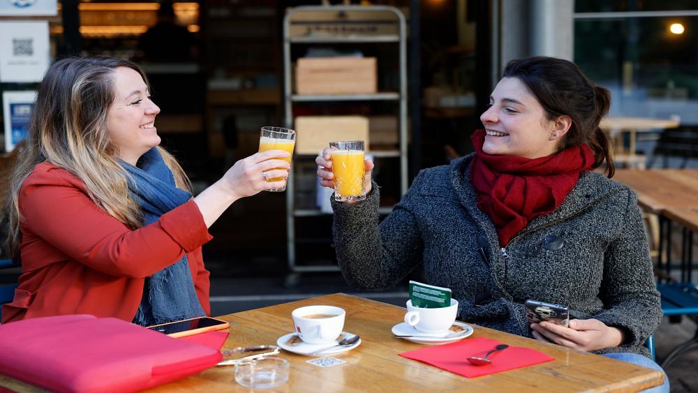 French people defy rain to enjoy reopening of café and bistro terraces