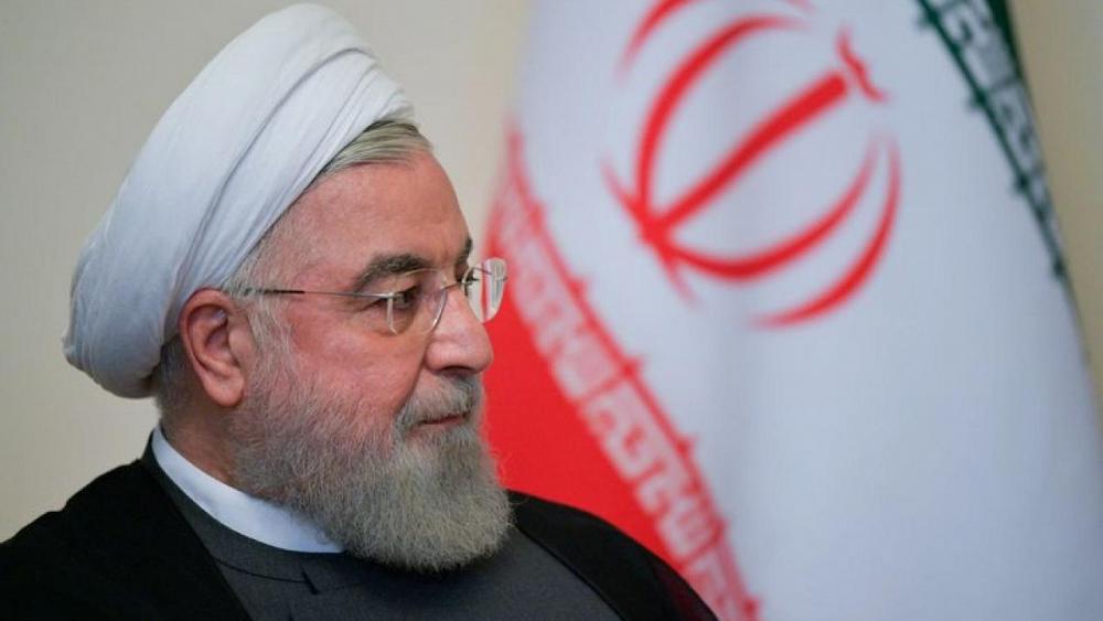 Iran's Rouhani says U.S. will lift sanctions, as another official denies it