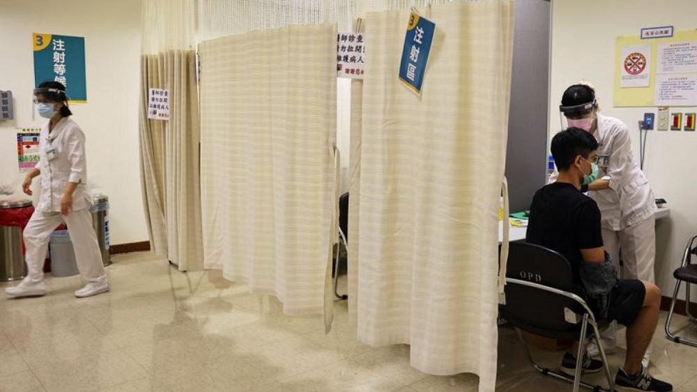 Pressure to accept China vaccines intensifies as Taiwan battles COVID surge