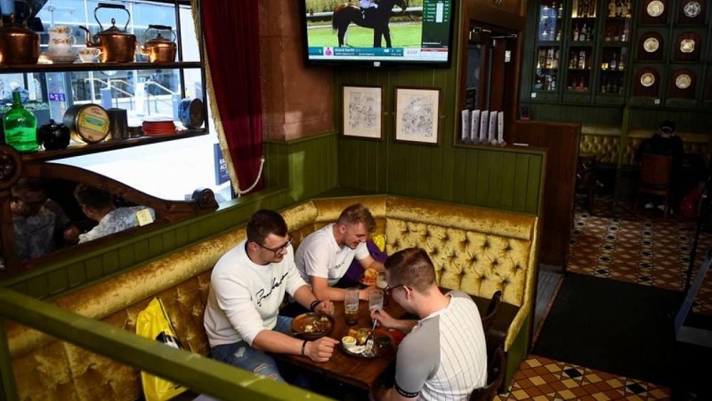 Factbox-Back to pubs, gyms and movies: plotting the road back to normal