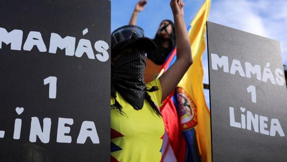 Amid tear gas and rocks, mothers take to front line of Colombia protests
