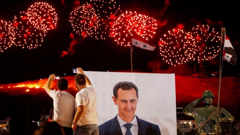 Syria's Assad hails vote, derided by opponents, as re-defining revolution