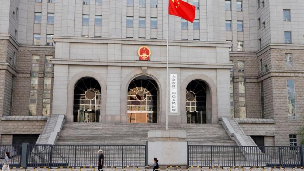 Australian blogger on trial in China worried political tensions may impact outcome