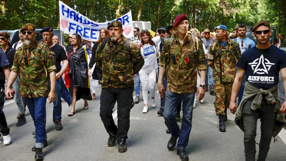 In pictures: Thousands protest in Brussels against COVID restrictions