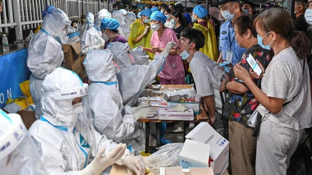 China's Guangdong tightens coronavirus measures as cases persist