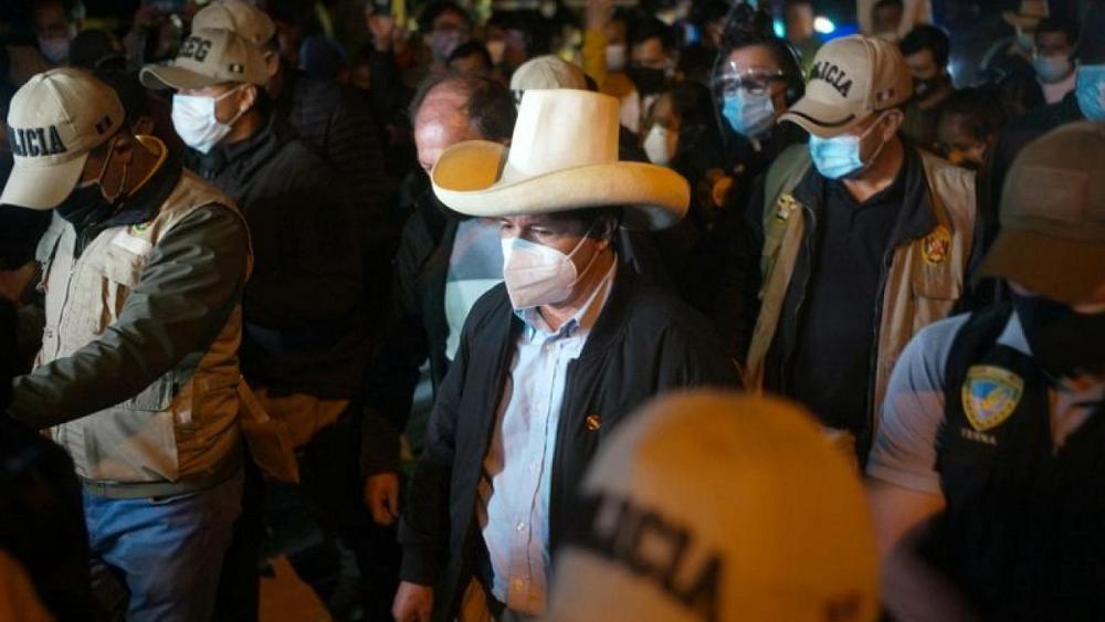 Peruvians vote to elect president, divided by class, geography