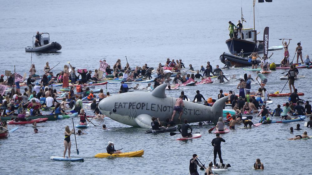 Climate change activists stage G7 protest on Cornwall beach