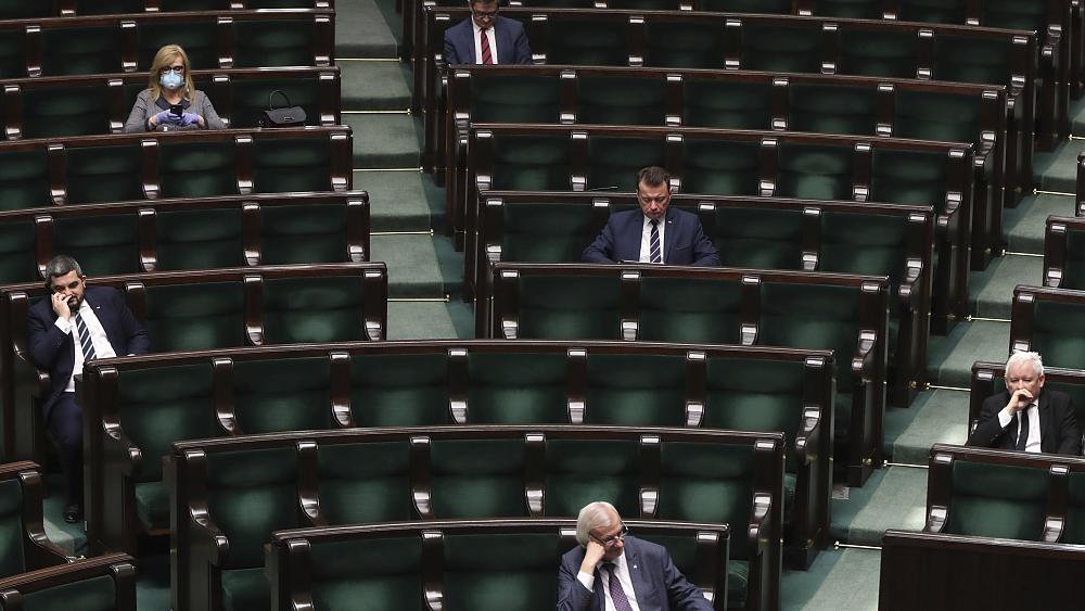 Poland's conservatives formally lose majority in parliament after three rebel MPs leave