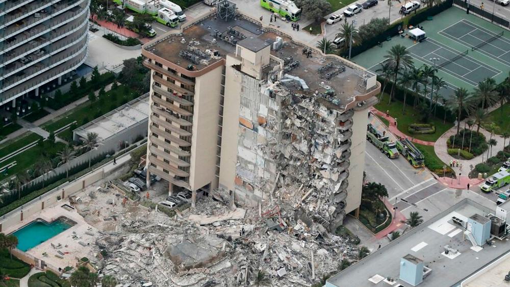 At least 1 dead after apartment building partially collapses near Miami